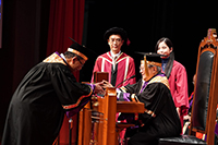 Dr. Norman N.P. Leung, Chairman of the Council presents the Ordinance of CUHK to Prof. Rocky Tuan